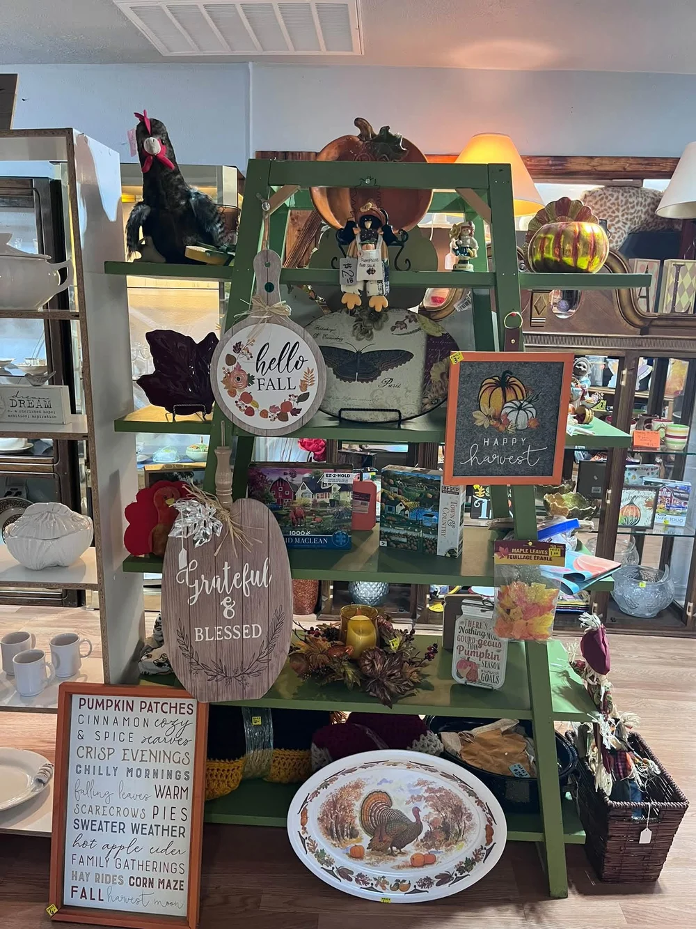 Home décor, dishes, puzzles and seasonal decorations displayed inside BAM Thrift store